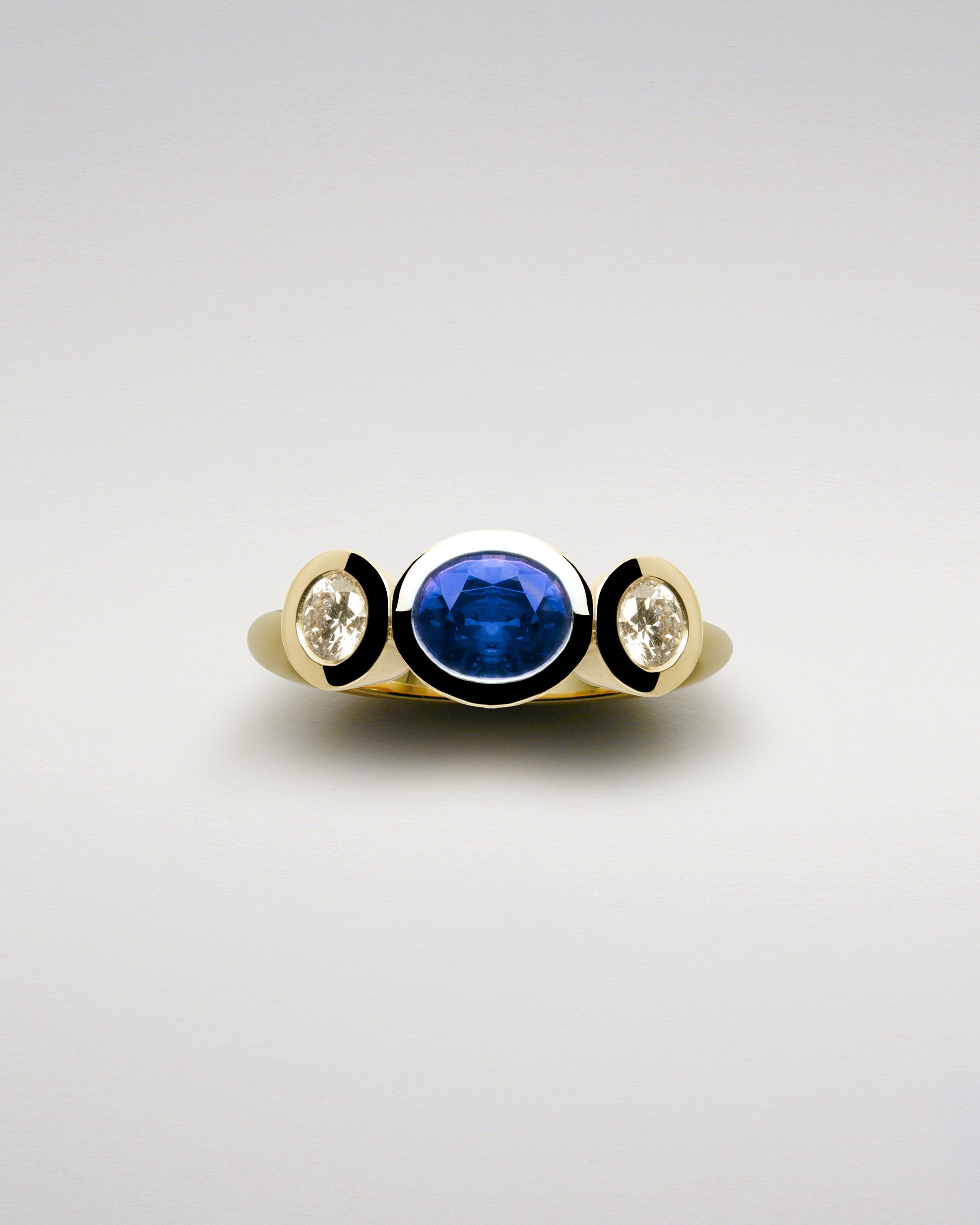Three Brilliants Ring with Sapphire and Diamonds
